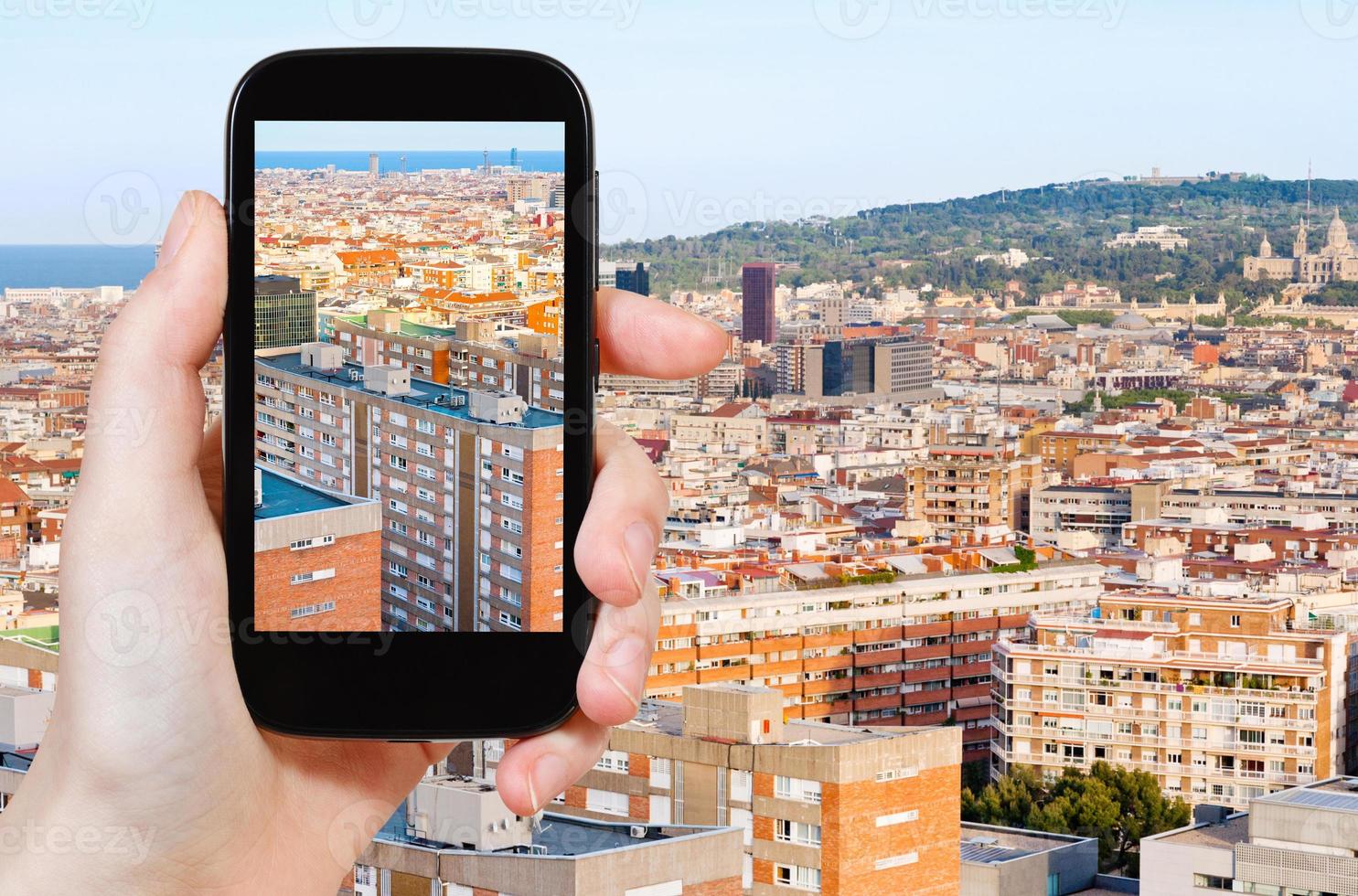 tourist taking photo of Barcelona skyline