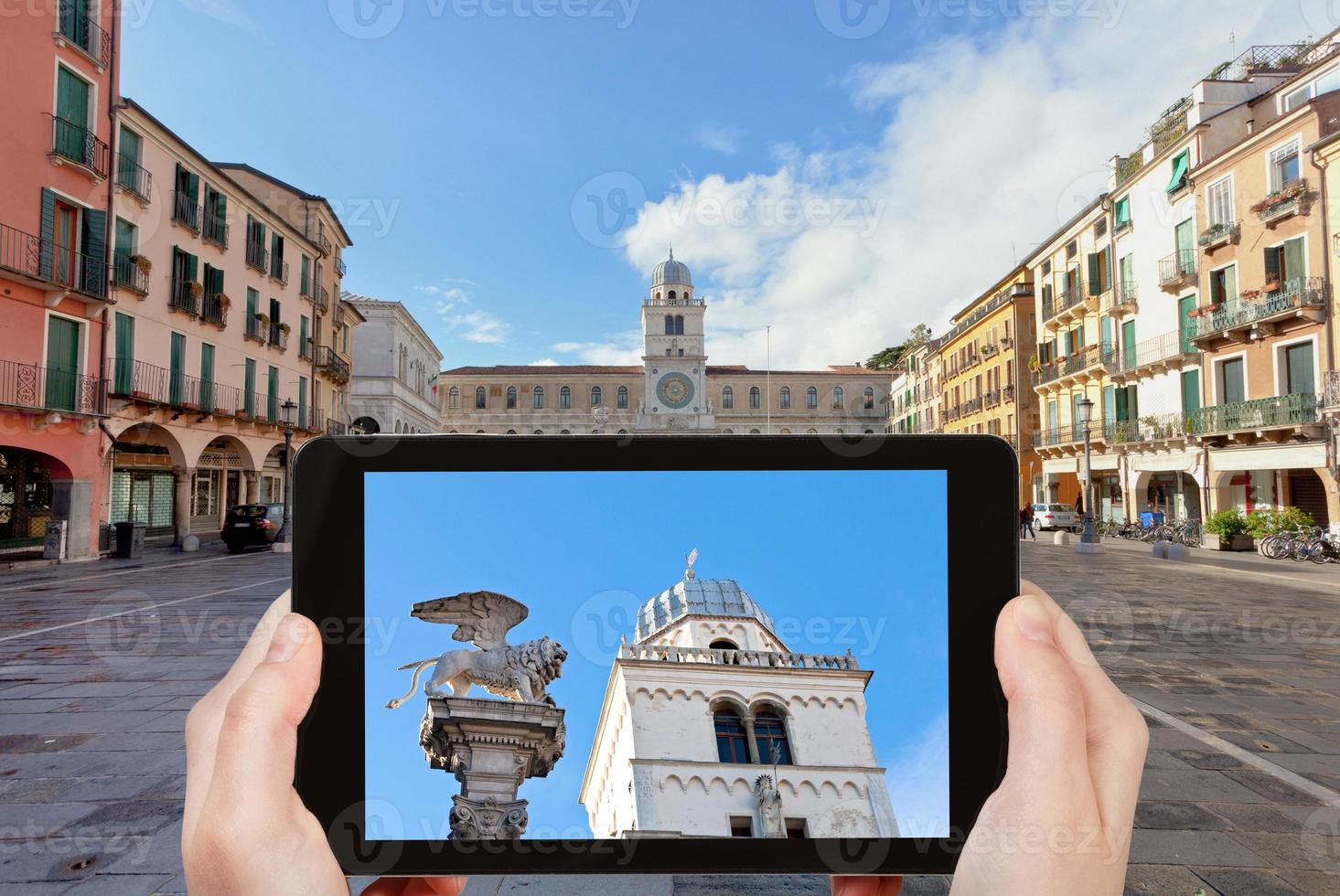 tourist taking photo of Piazza dei Signori in Padua