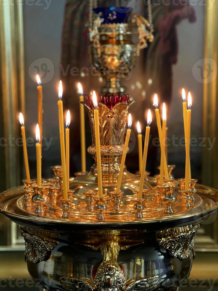 Burning candles in a Christian church photo