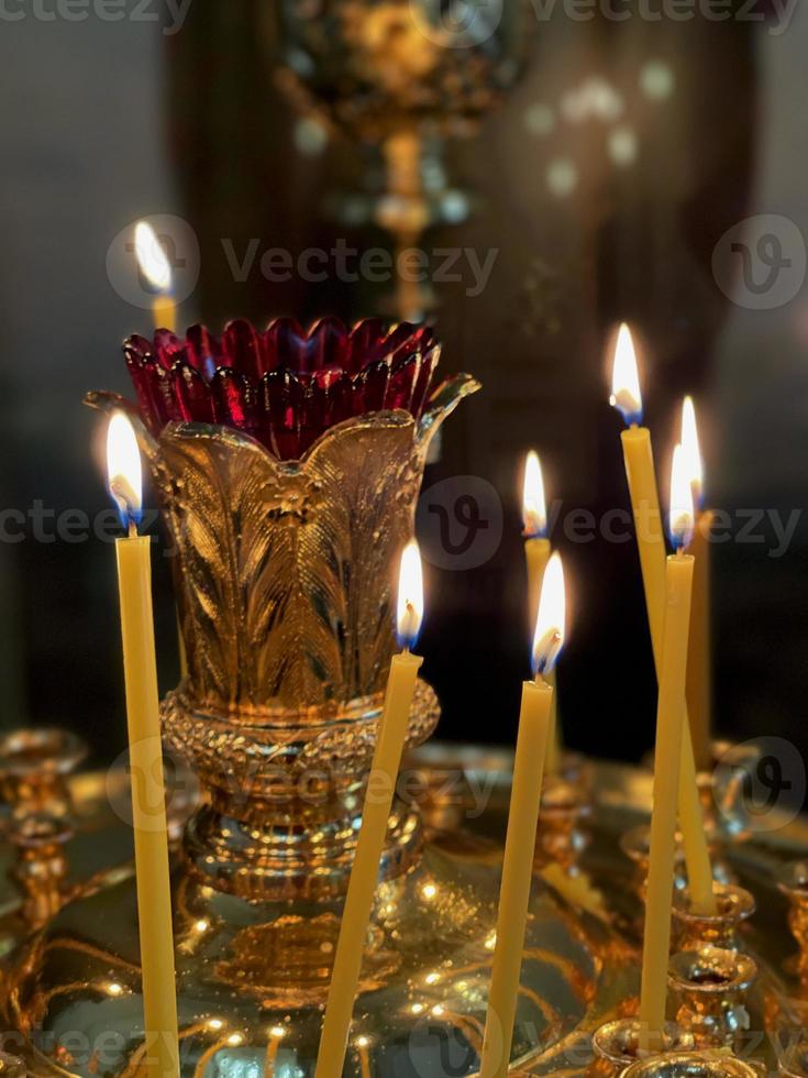 Burning candles in a Christian church photo