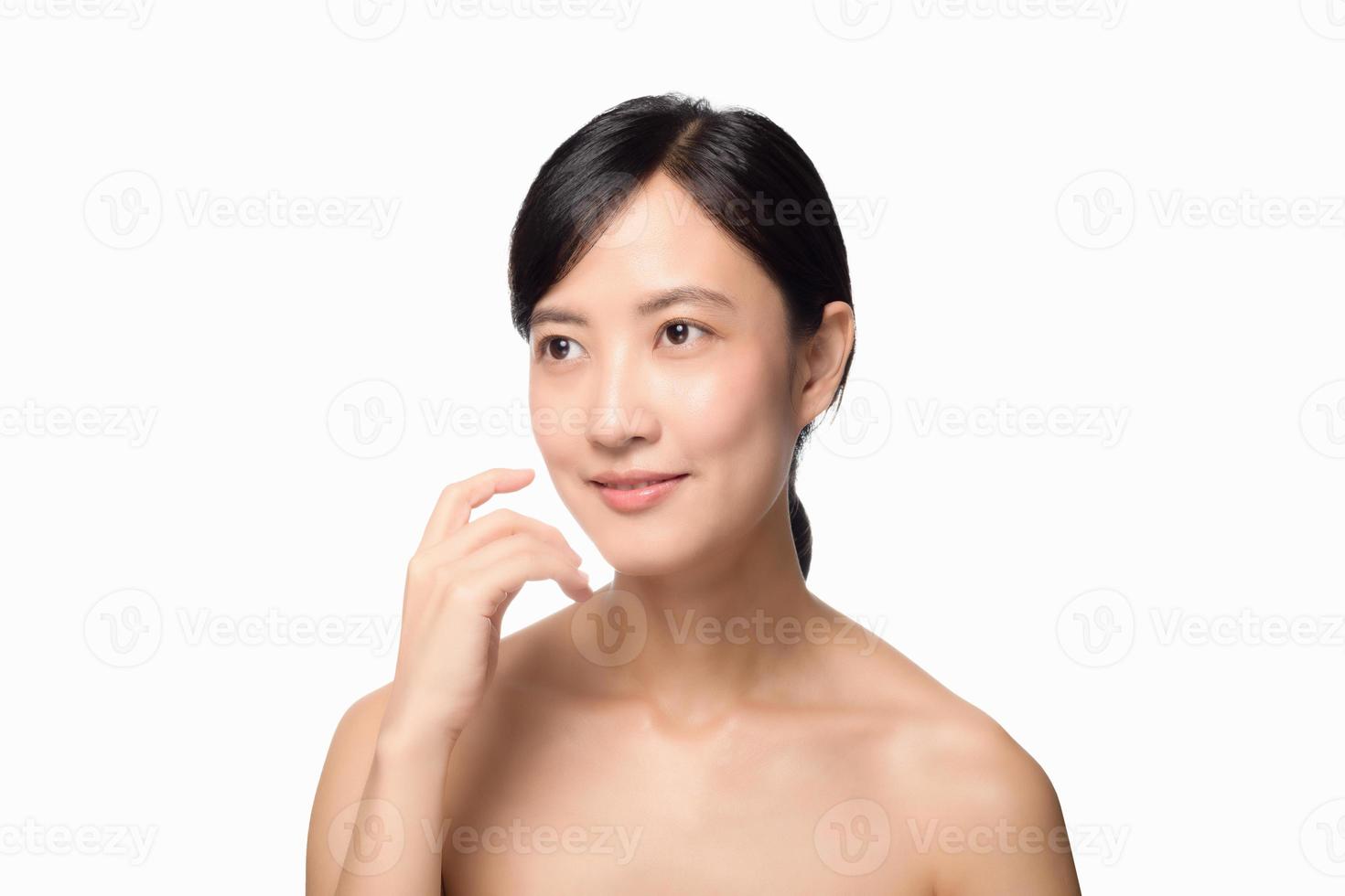 studio portraits of asian women applying serums. photo