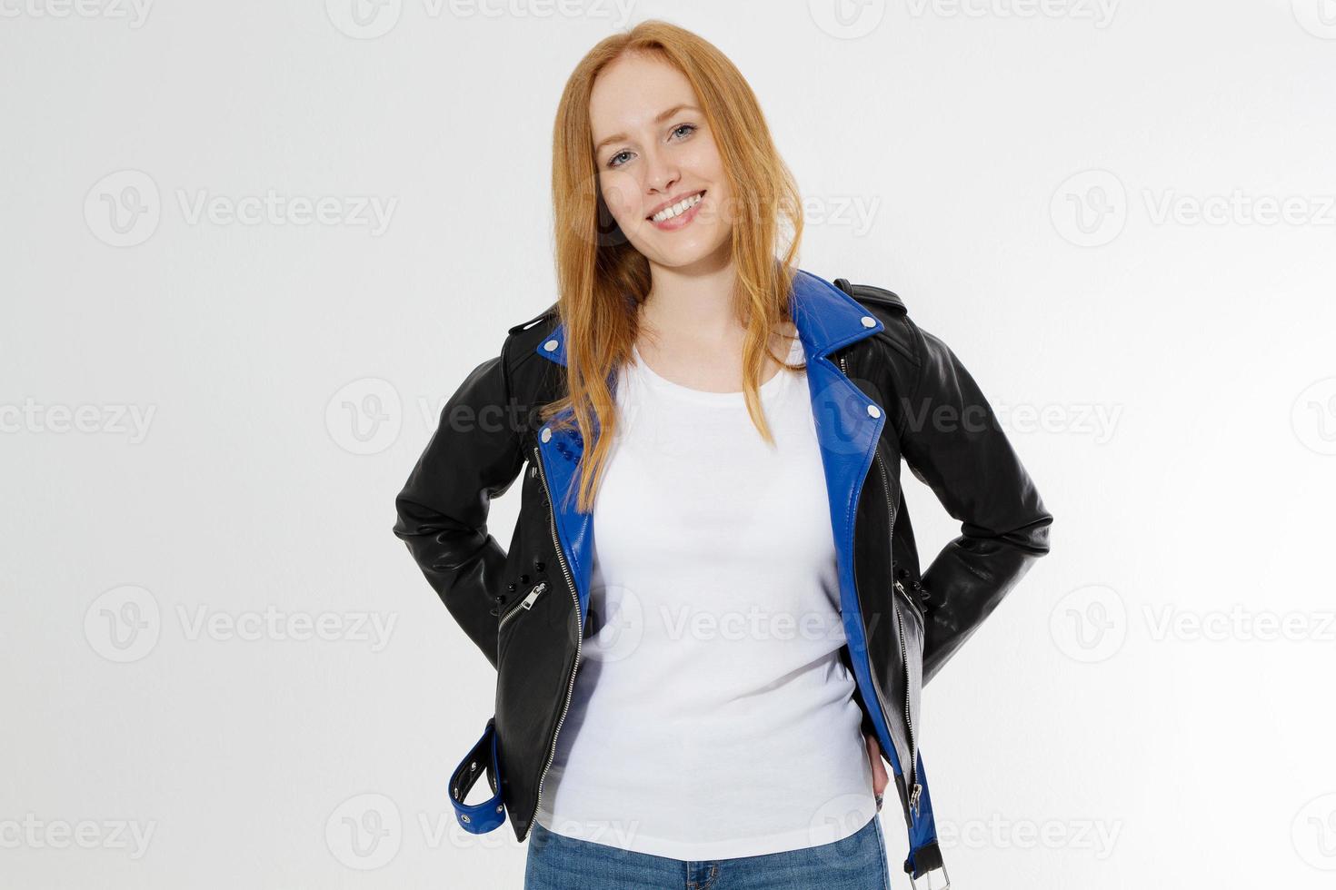 Woman in white t shirt and black leather jacket isolated on white background. Red hair girl in fashion clothes front view. Blank template summer t-shirt. Copy space photo
