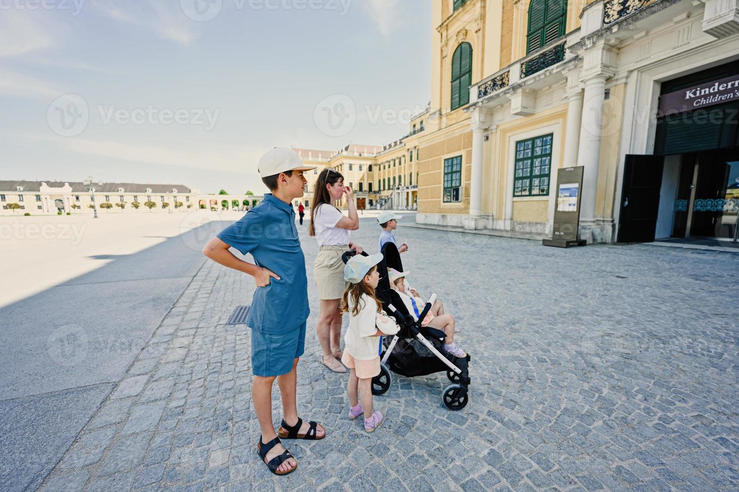 Mother with children walking at Schonbrunn Palace in Vienna, Austria. photo