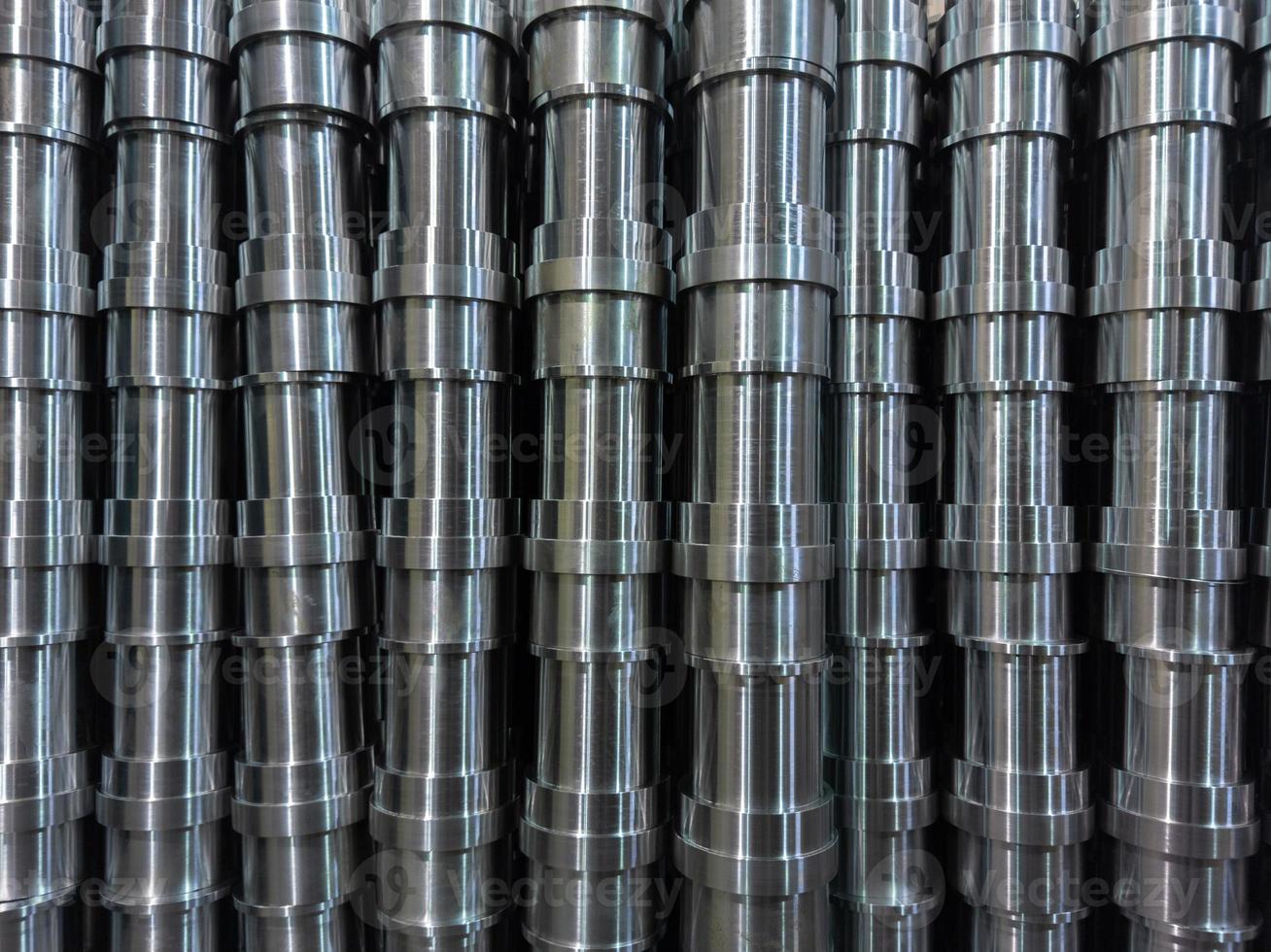 shiny steel production stack full frame background with cnc machined pipes photo