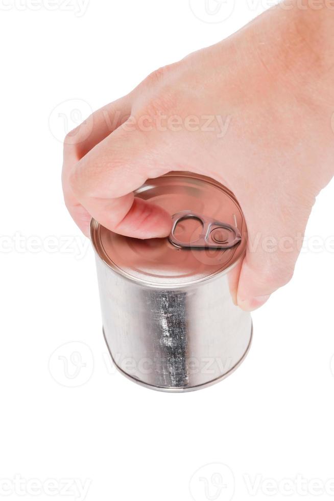 bare caucasian hand opens a tin can with a pull ring on a white background photo