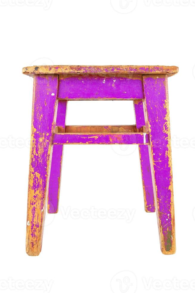 Old wooden stool with peeling pink paint. Loft style chair isolated on a white background. photo