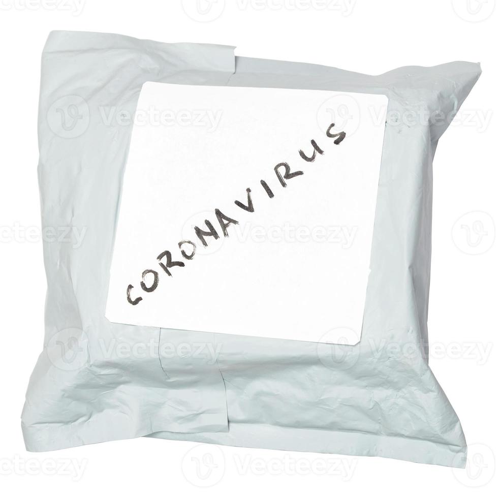 small packet parcel from china with label coronavirus on it - isolated on white background photo