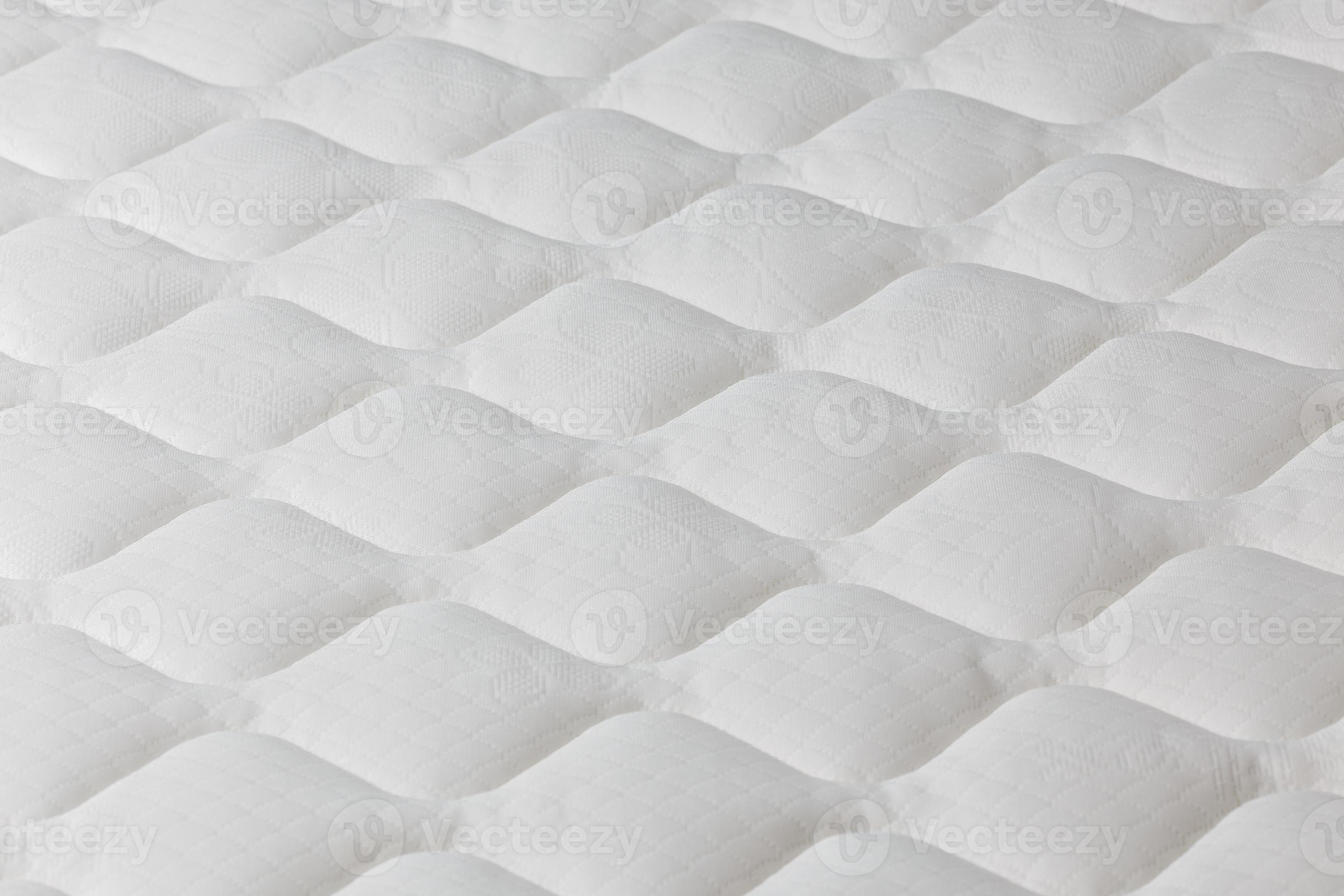 Soft white mattress closeup background with selective focus. 12673887 Stock Photo at Vecteezy