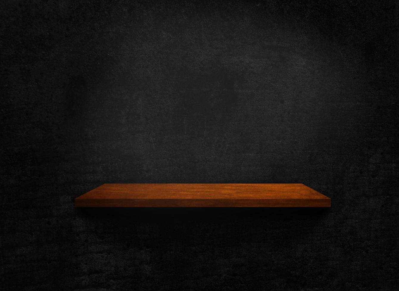 Blank of old wooden shelf on dark wall texture background with clipping path for design photo