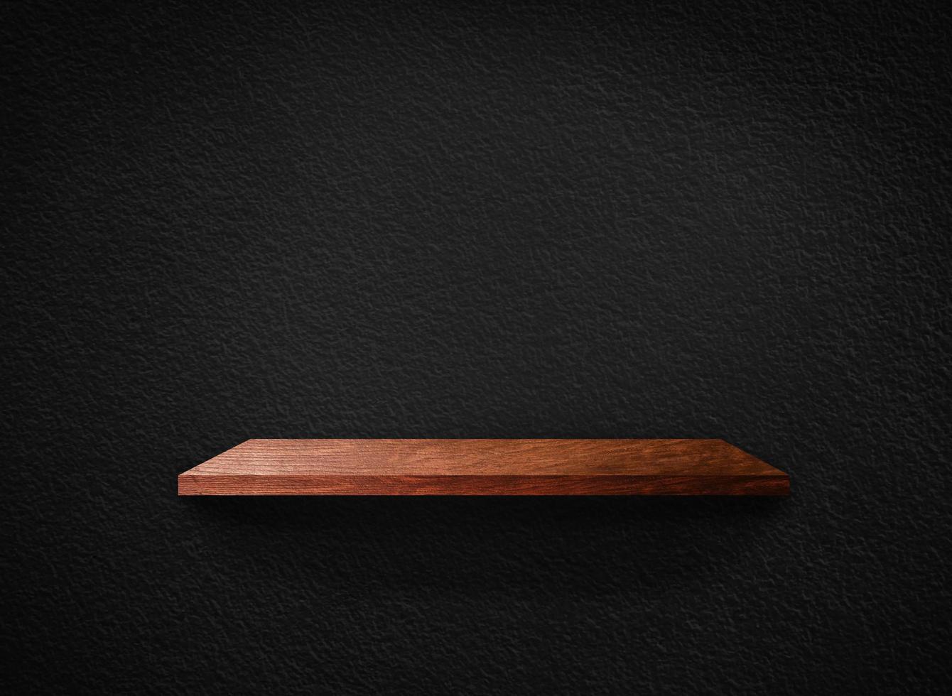 Light wood shelves on black wall texture in loft Style  background with clipping path. Design for wallpaper photo