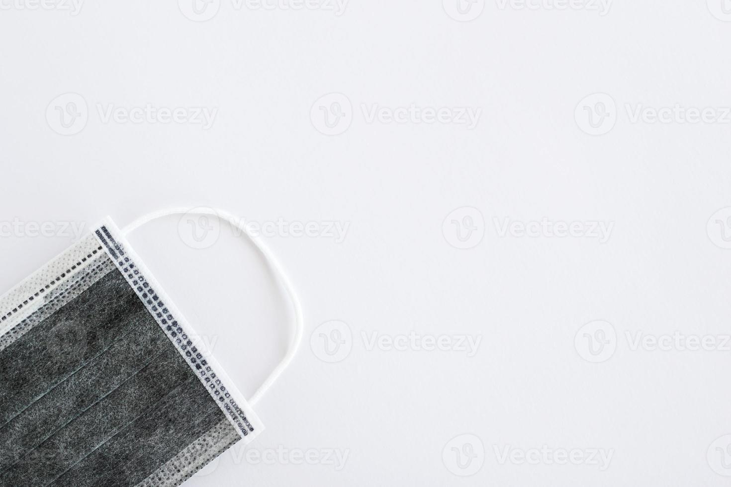 Flat lay on medical face mask on white background with copy space. Healthcare and medical concept. photo