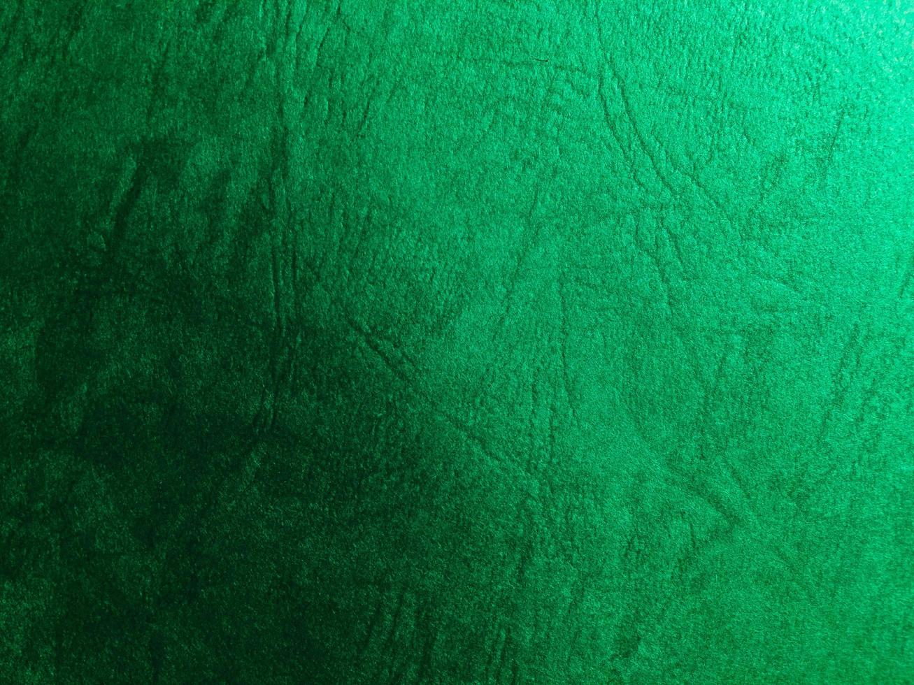 Green paper texture background with pattern for design. Copy space for text and work photo