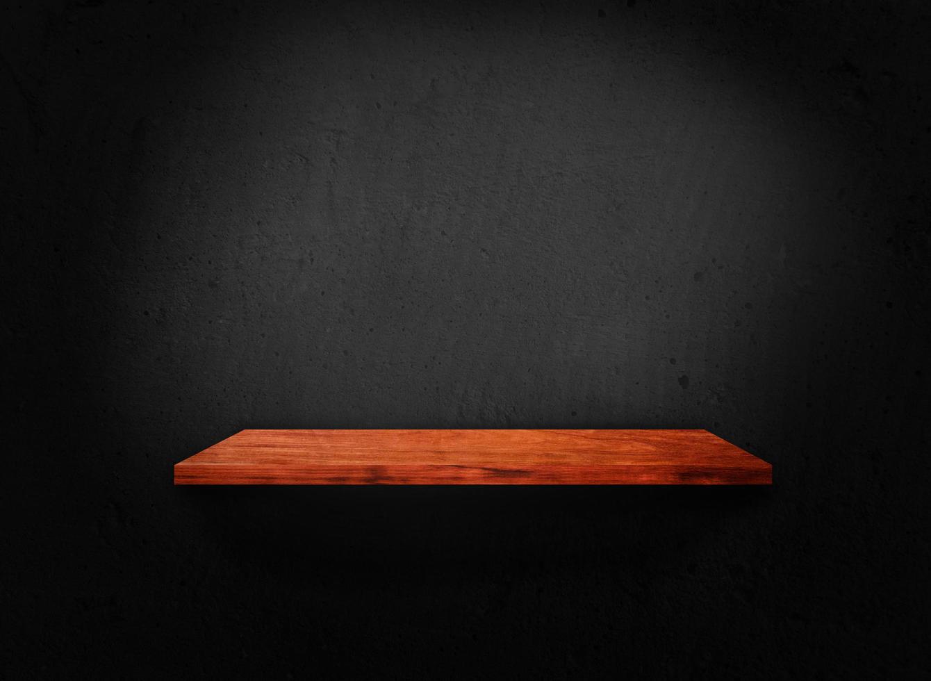 Blank of old wooden shelf on dark wall texture background with clipping path for design photo