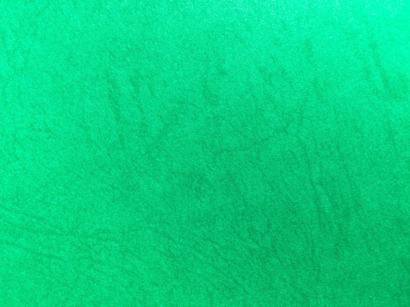 Green paper texture background with pattern for design. Copy space for text and work photo