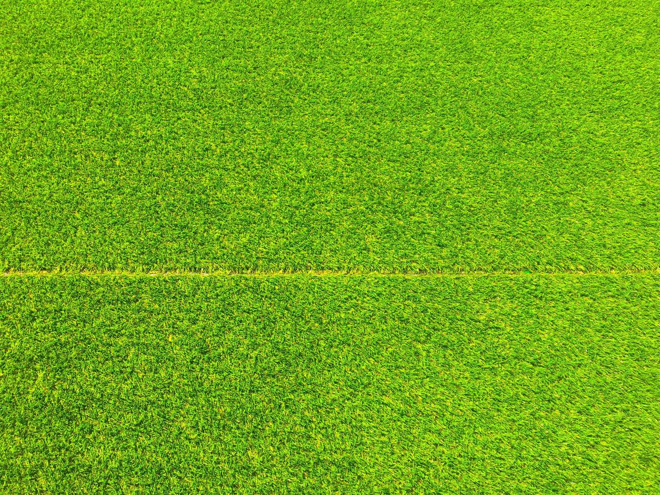 Artificial grass background for design, top view photo