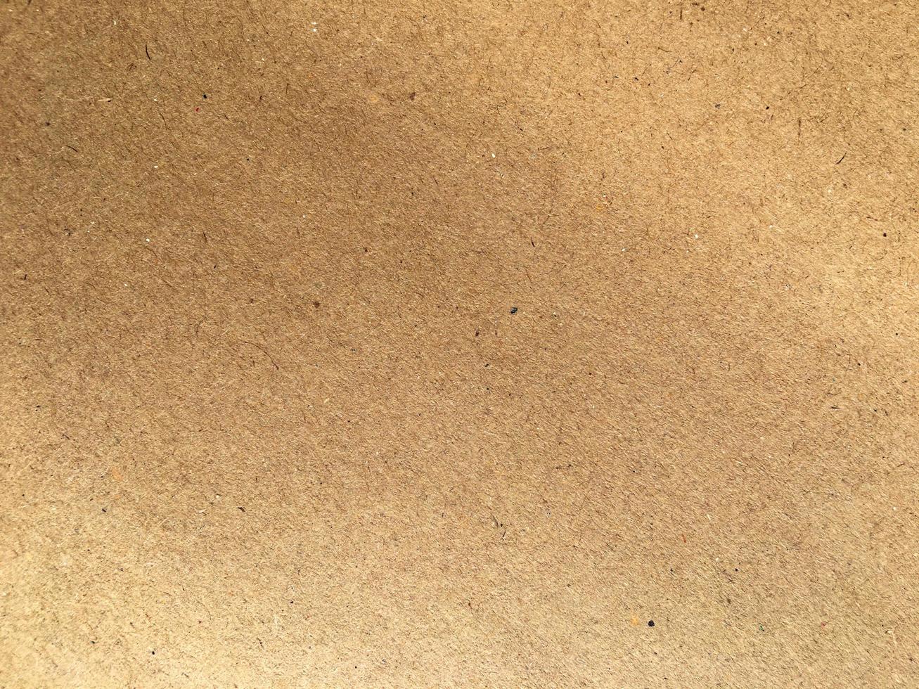 Old brown paper texture background or cardboard with copy space for design. photo