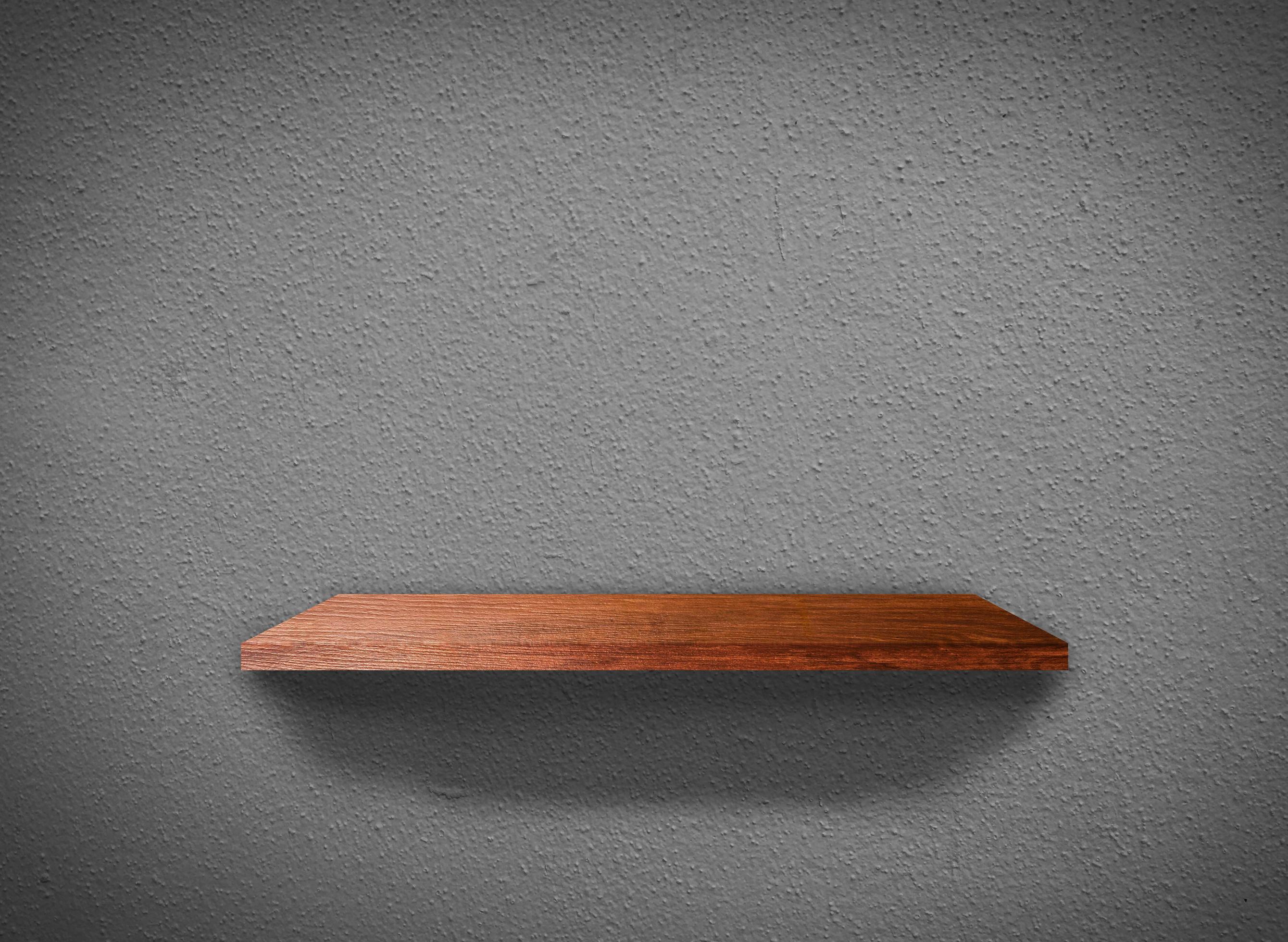 Hardwood shelves on concrete wall texture in minimal Style background