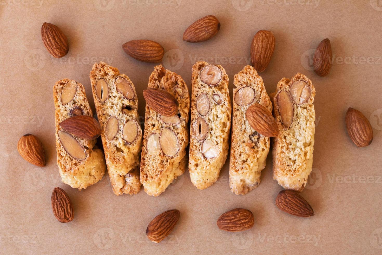 Sweet Italian cookies - cantuccini or biscotti with almond on craft paper, top view. Traditional bakery of Tuscany. photo