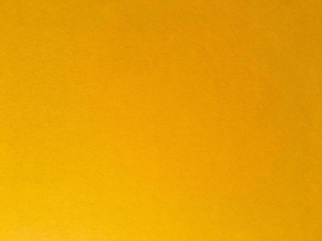 Yellow paper texture background for design. Wallpaper with copy space photo