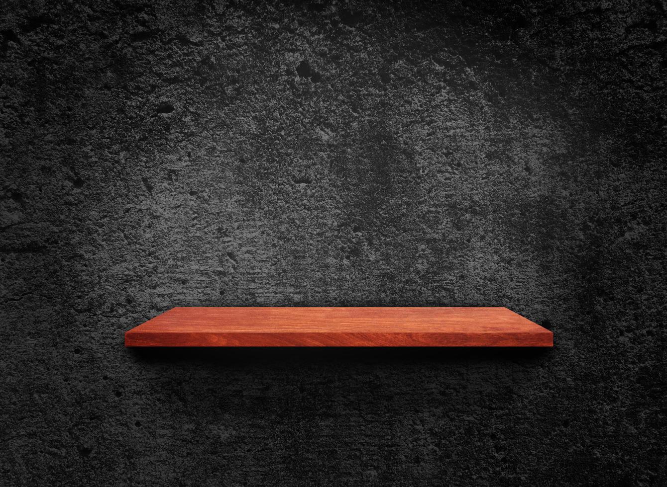 Blank of old wooden shelf on dark wall texture background with clipping path for design photo