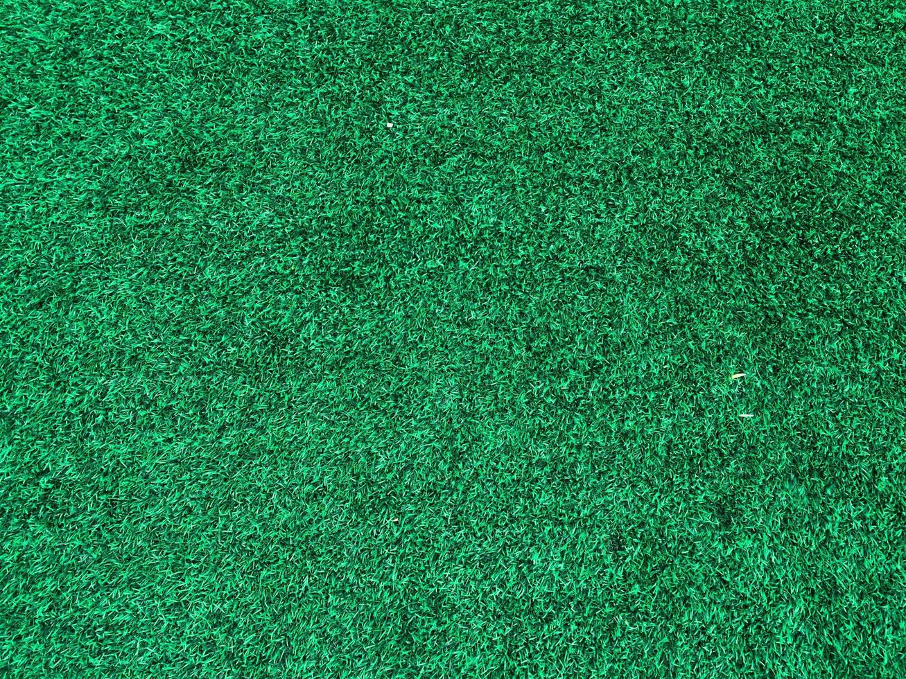 Artificial grass background for design, top view photo