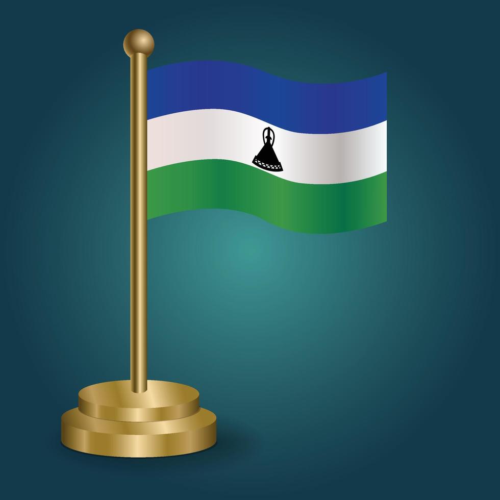 Lesotho national flag on golden pole on gradation isolated dark background. table flag, vector illustration