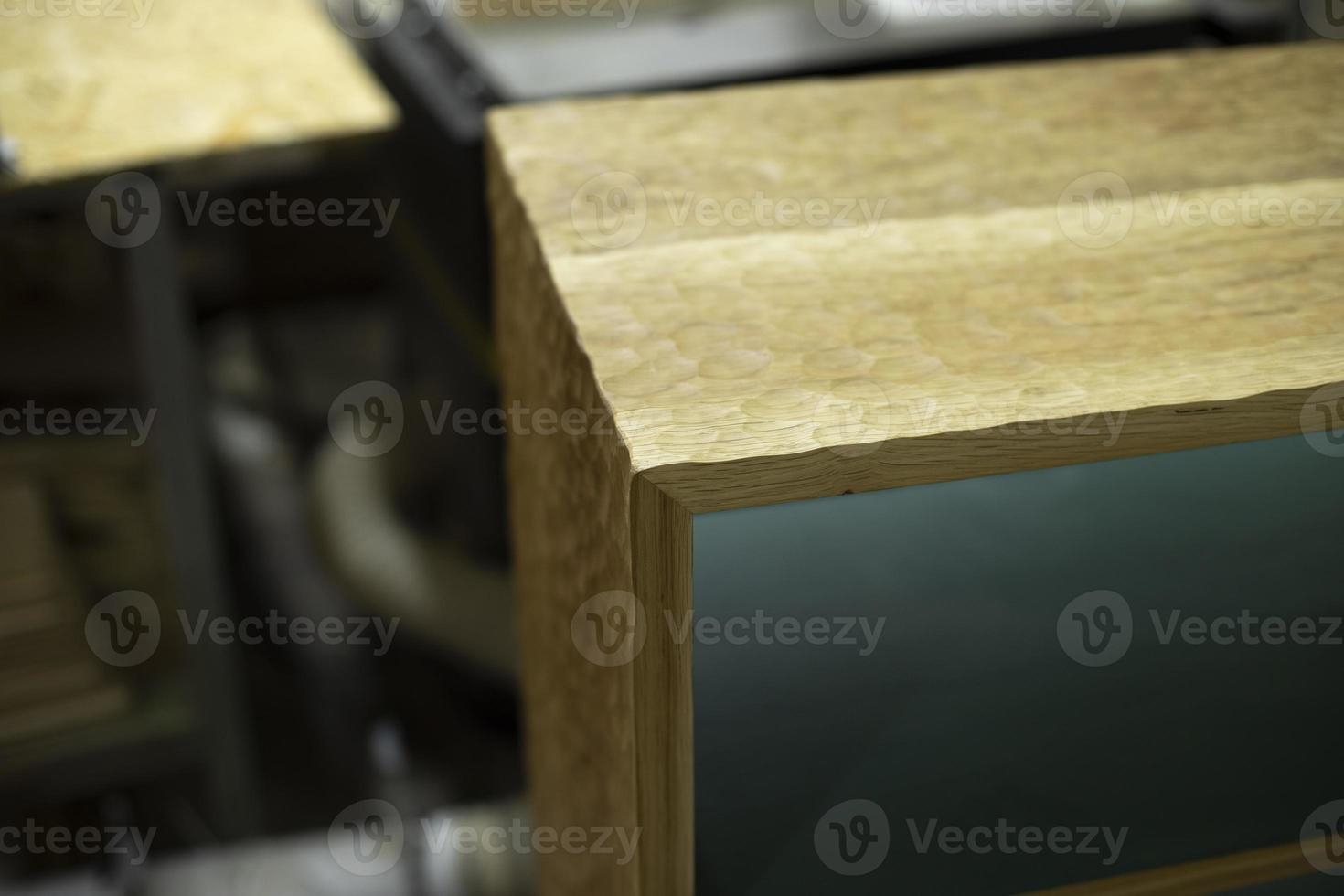 Manufacture of furniture in carpentry workshop. Wooden wardrobe. Original product. photo