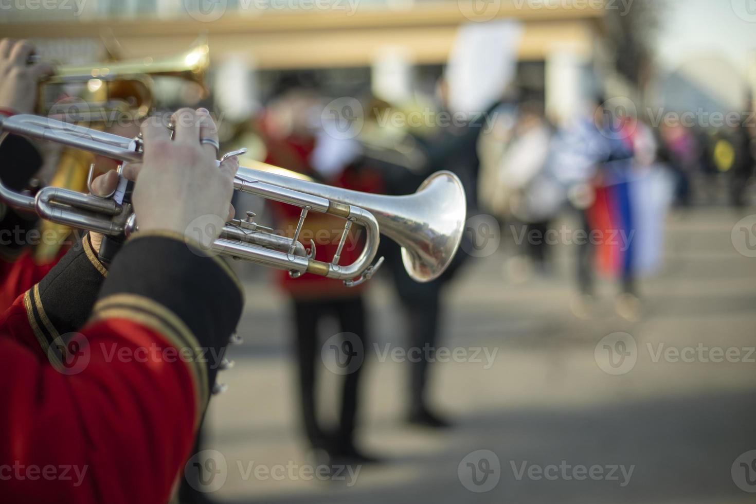 Orchestra with wind instruments. Trumpeters in ceremonial uniforms. photo