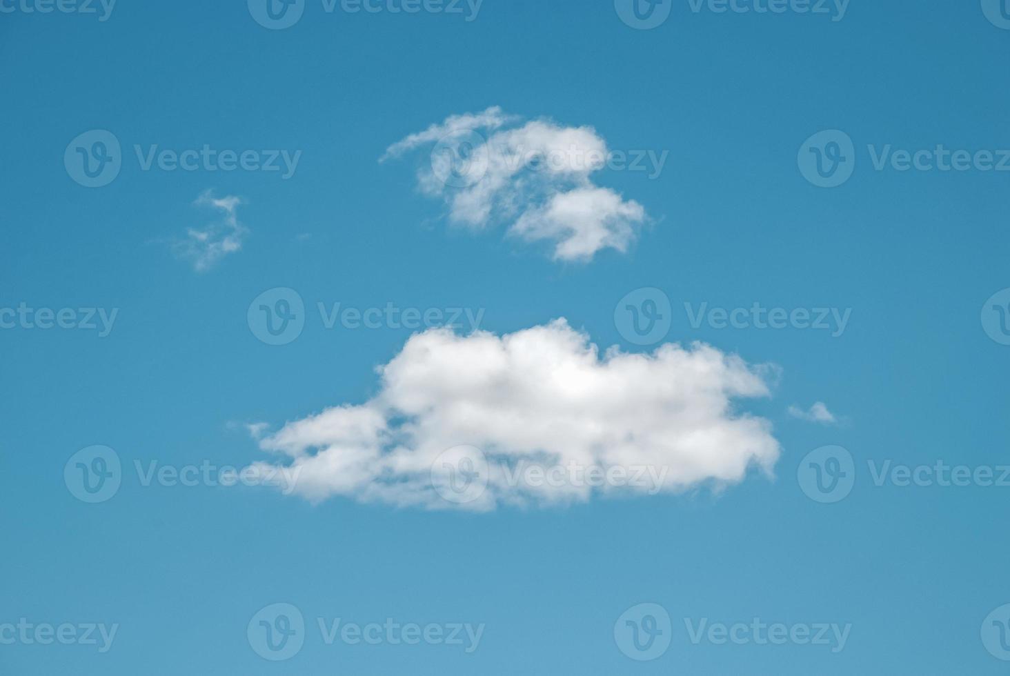 Blue summer sky with few sparse clouds, idyllic cloudscape with copy space photo