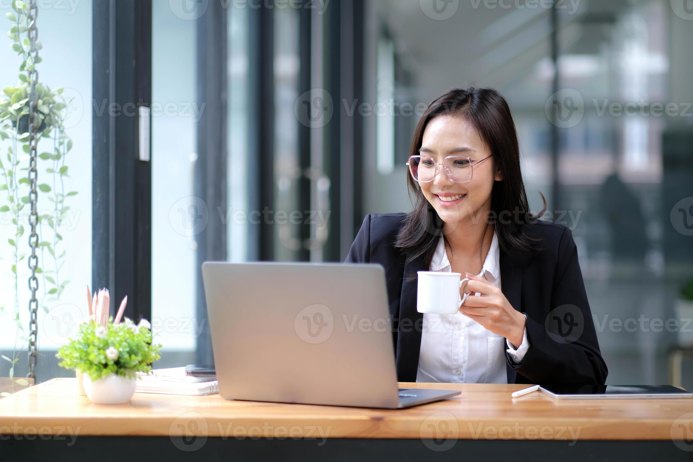Professional asian businesswoman or female manager sits at her office