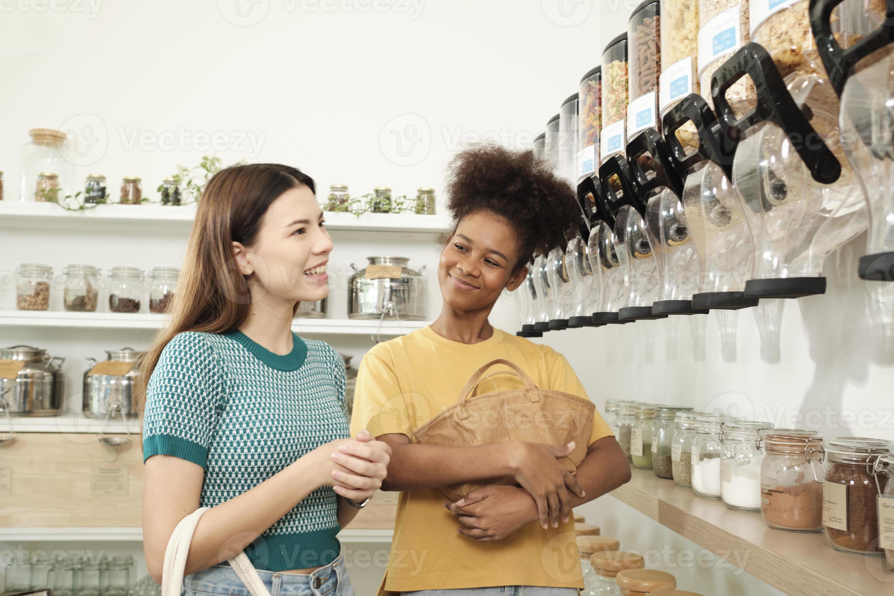 Two happy young female customers are choosing and shopping for organic  products in refill store with reusable bags, zero-waste grocery, and  plastic-free, environment-friendly, sustainable lifestyles. 12684478 Stock  Photo at Vecteezy