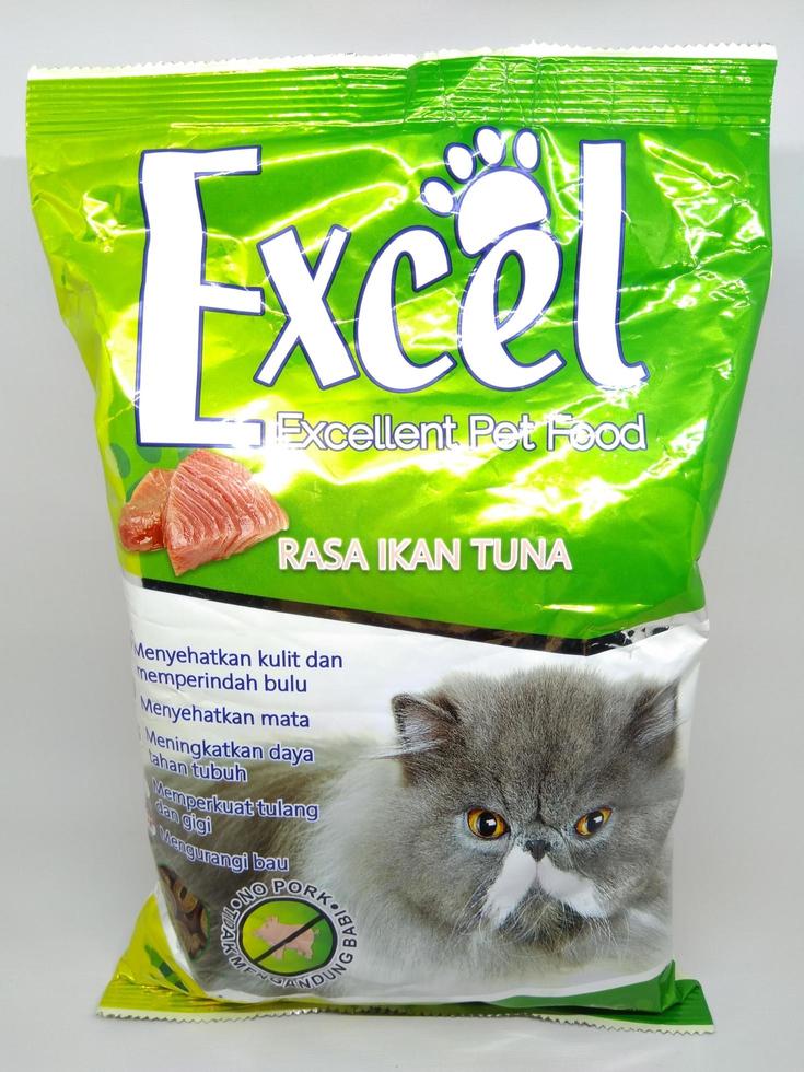 Cat food wrapped in plastic on a white background photo
