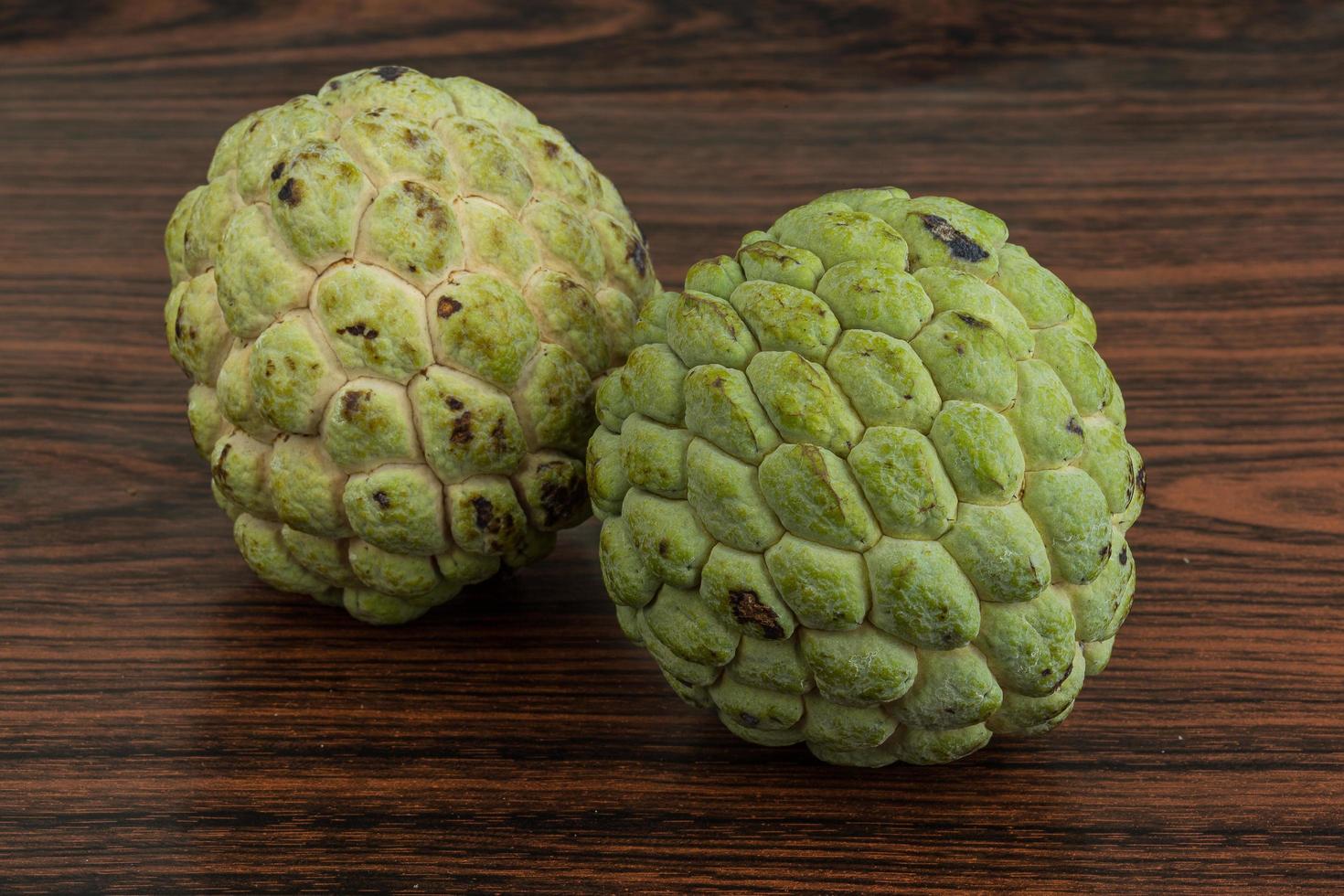 Custard apple on wooden background photo