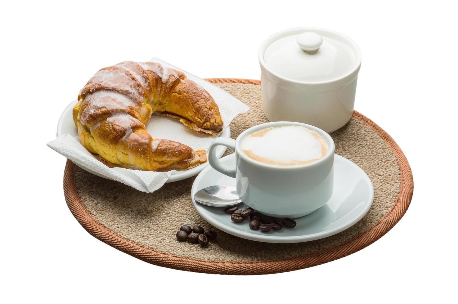 Cappuccino on wooden board and white background photo