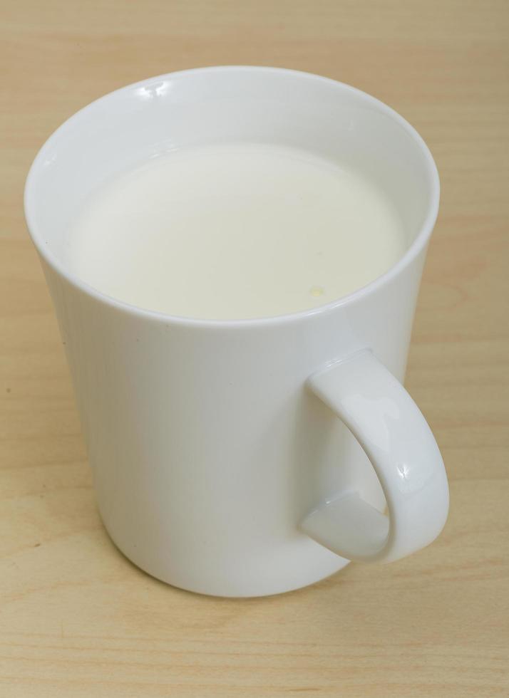 Kefir on wooden background photo