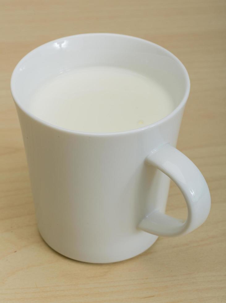 Kefir on wooden background photo