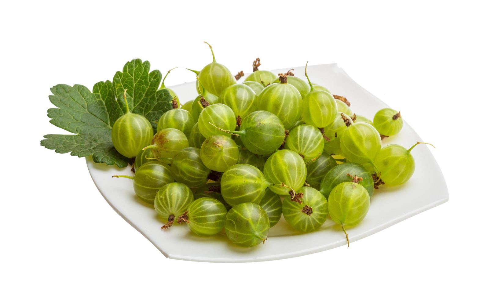 Gooseberry on the plate and white background photo