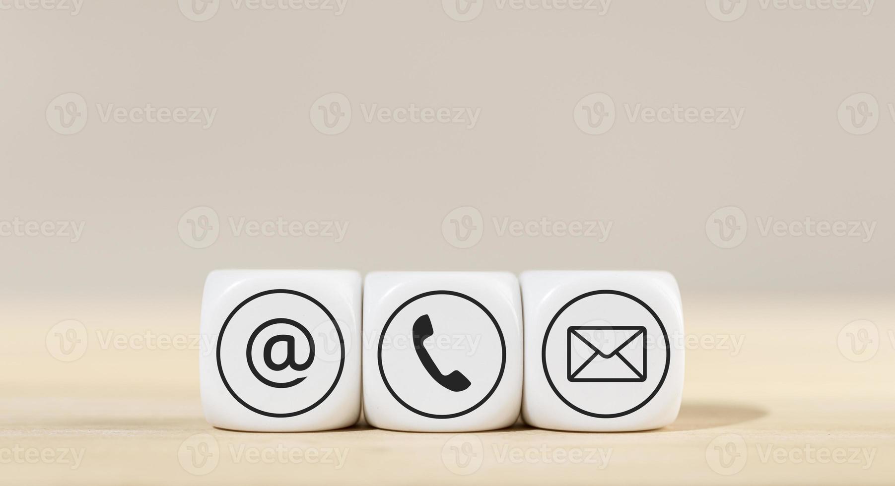 Contact us icons on white cube blocks photo