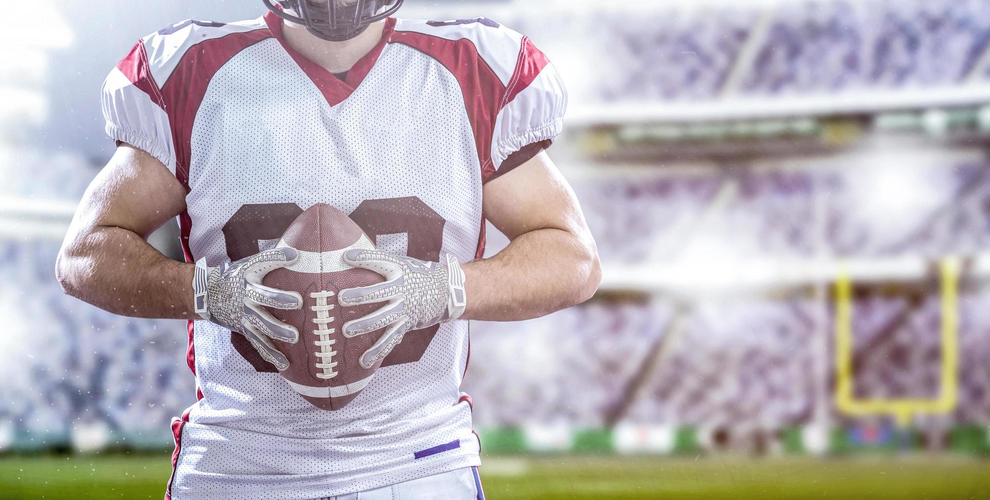 closeup American Football Player isolated on big modern stadium photo