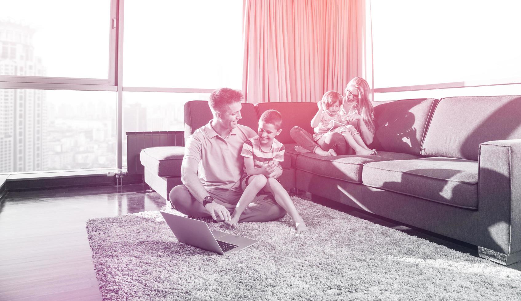 Happy family playing a video game photo