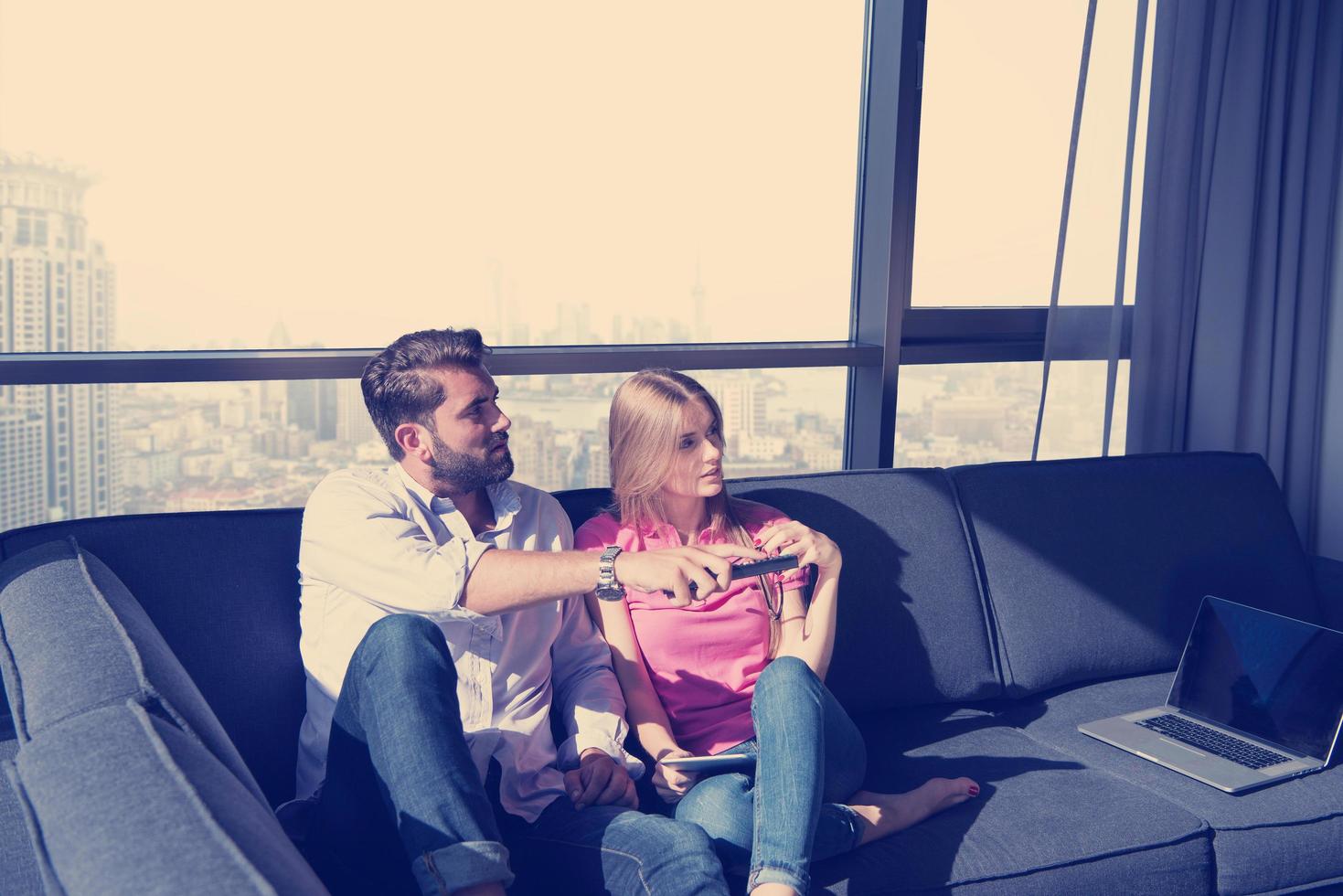 Young couple watching television photo