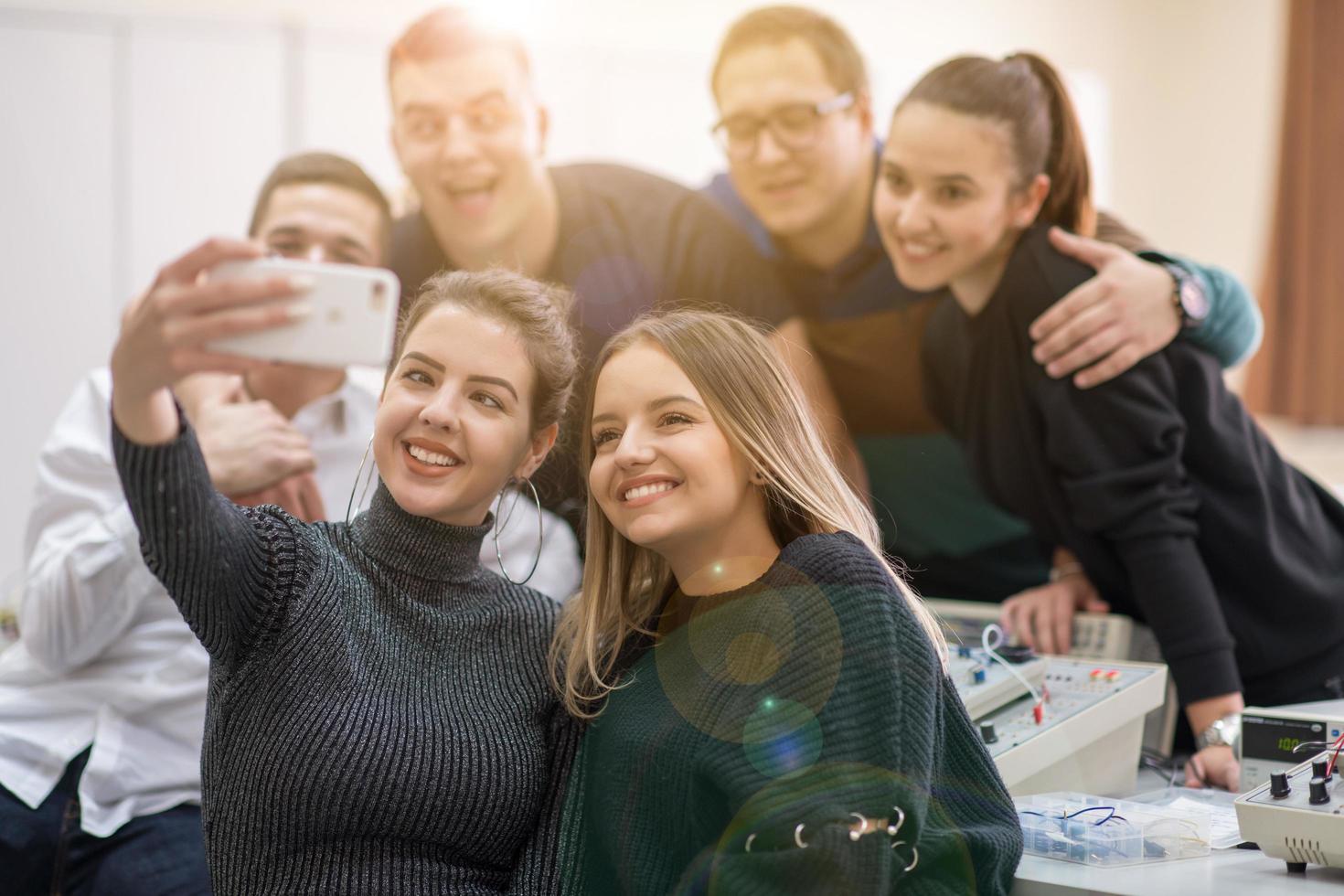 young happy students doing selfie picture photo