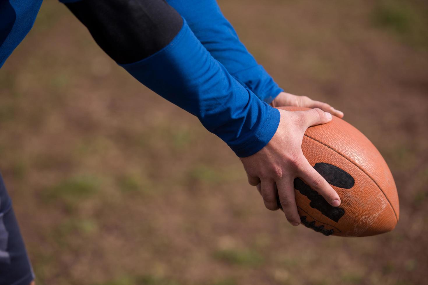 american football kicker practicing kickoff photo