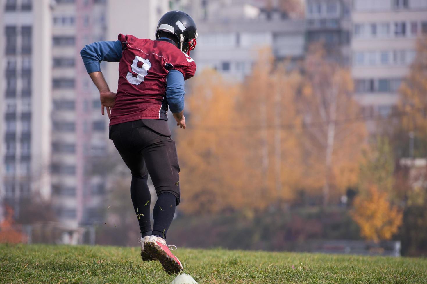 american football player in action photo