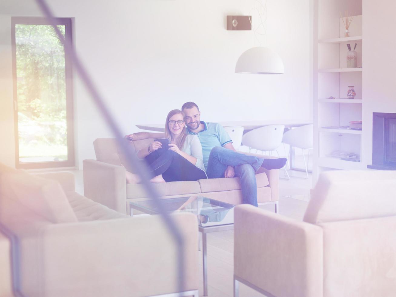 couple relaxes in the living room photo