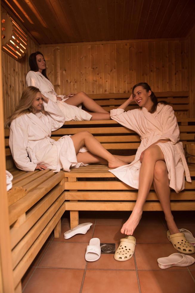 a group of young women in a sauna photo