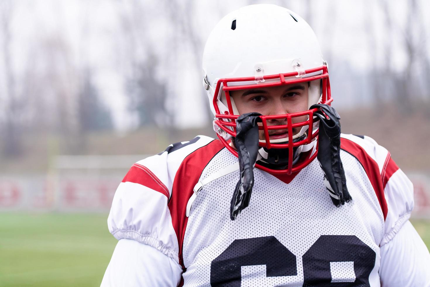 portrait of young confident American football player photo