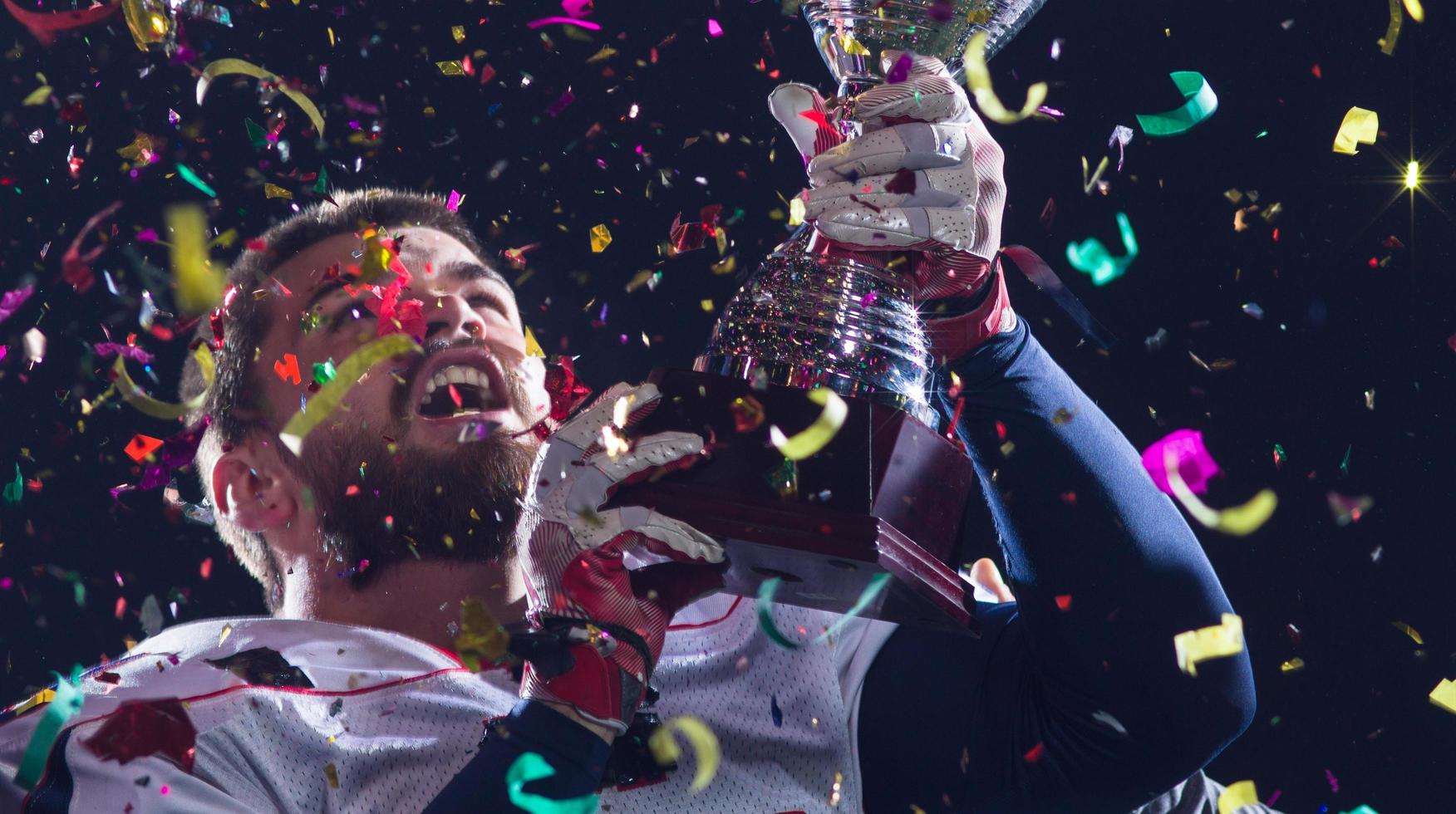 american football team celebrating victory photo