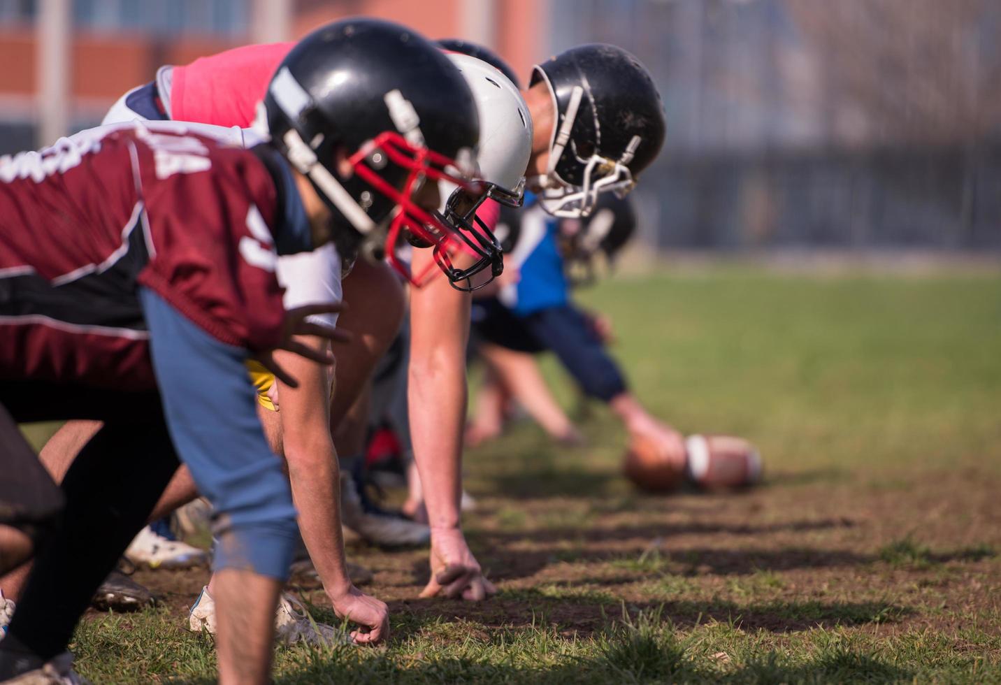 american football team in action photo