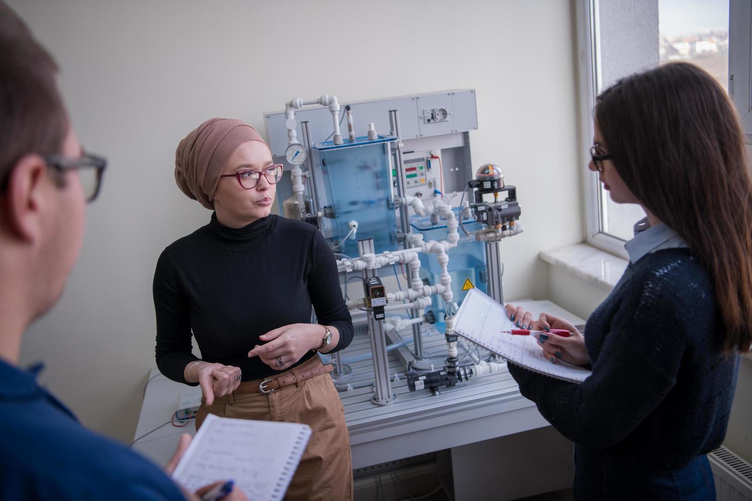 young students doing practice in the electronic classroom photo